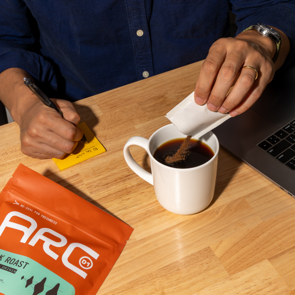 Pouring Instant Coffee at work desk
